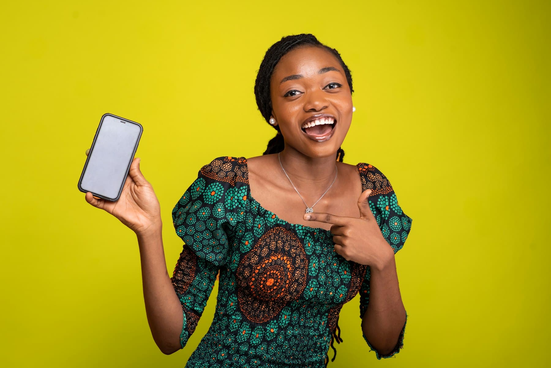 A woman in a green ankara dress