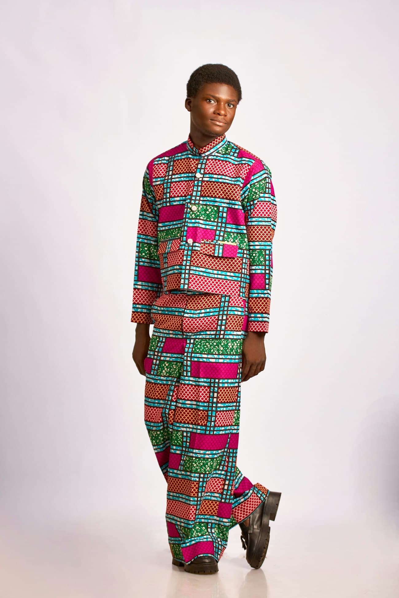 A man in a matching print suit