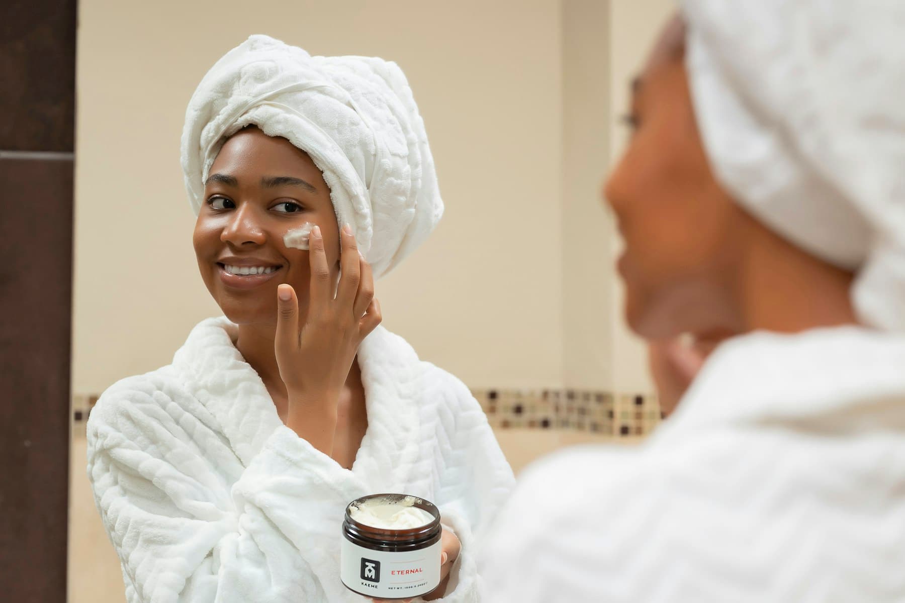 A woman applying body butter